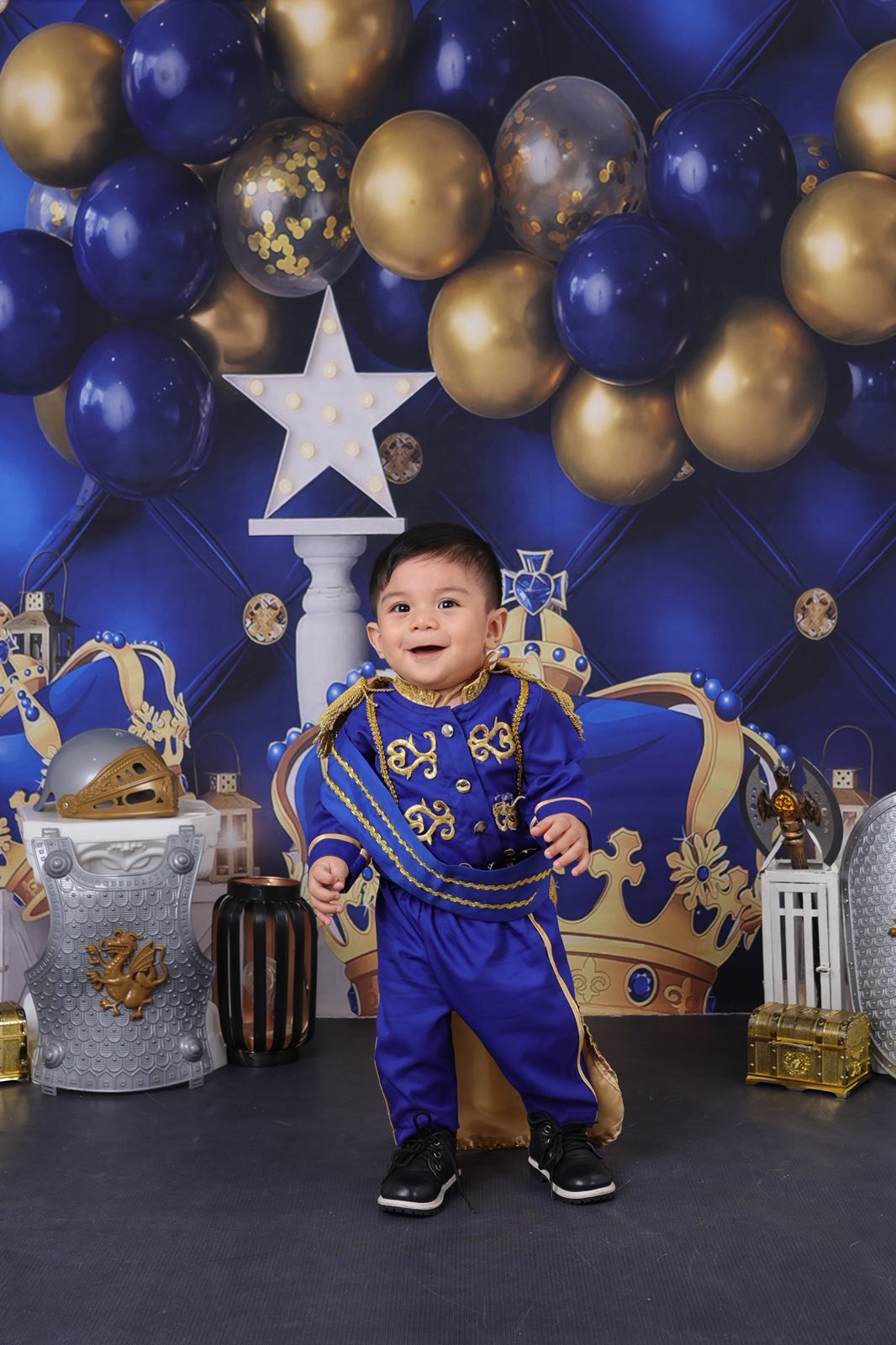 Archer in Royal Prince blue suit standing smiling