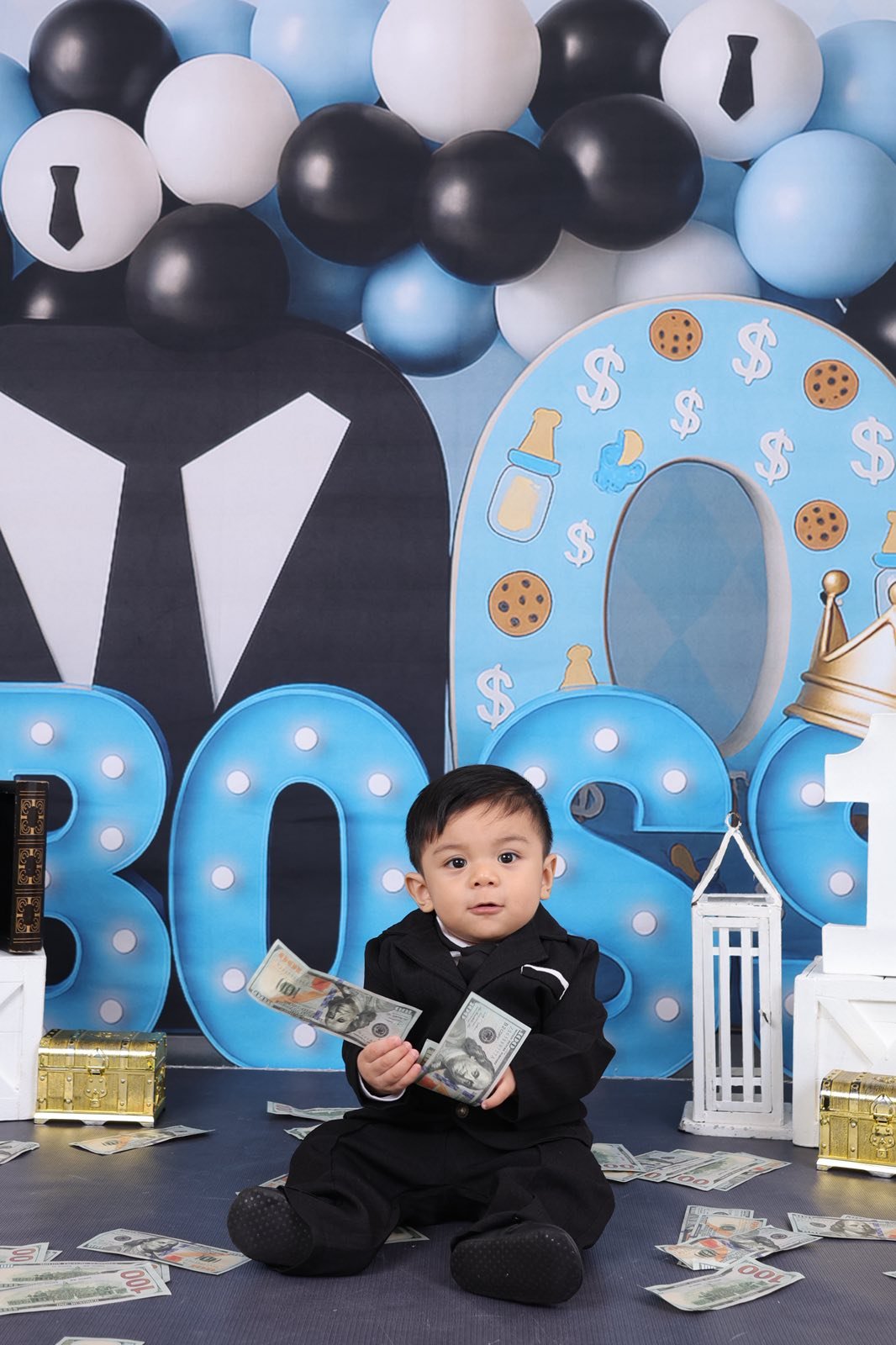 Archer sitting on floor holding dollar bills